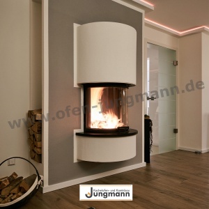 Heizkamin halbrund in ausgefallenem Design in Paderborn aufgebaut von Kachelofen Jungmann aus Delbrück